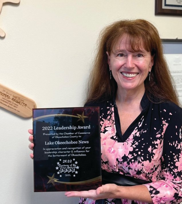 OKEECHOBEE -- Lake Okeechobee News Editor Katrina Elsken proudly displays the 2022 Leadership Award, presented to the Lake Okeechobee News "in appreciation and recognition of your leadership, character and influence for the betterment of Okeechobee.